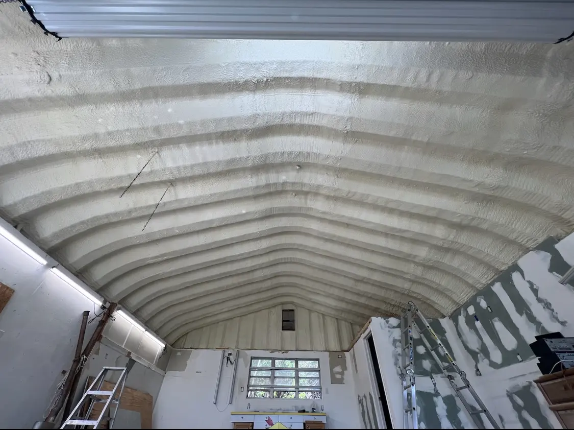 Spray polyurethane foam applied to the underside of a metal roof deck in Bangor Base